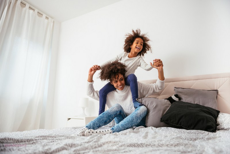 child and mother playing together